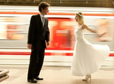 Bride and Groom next to a moving metro